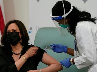 Harris vaccinated on camera, urges public to trust process