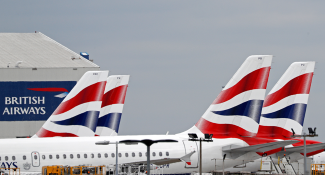 Countries suspend flights from UK as US Lawmakers reach COVID-19 deal