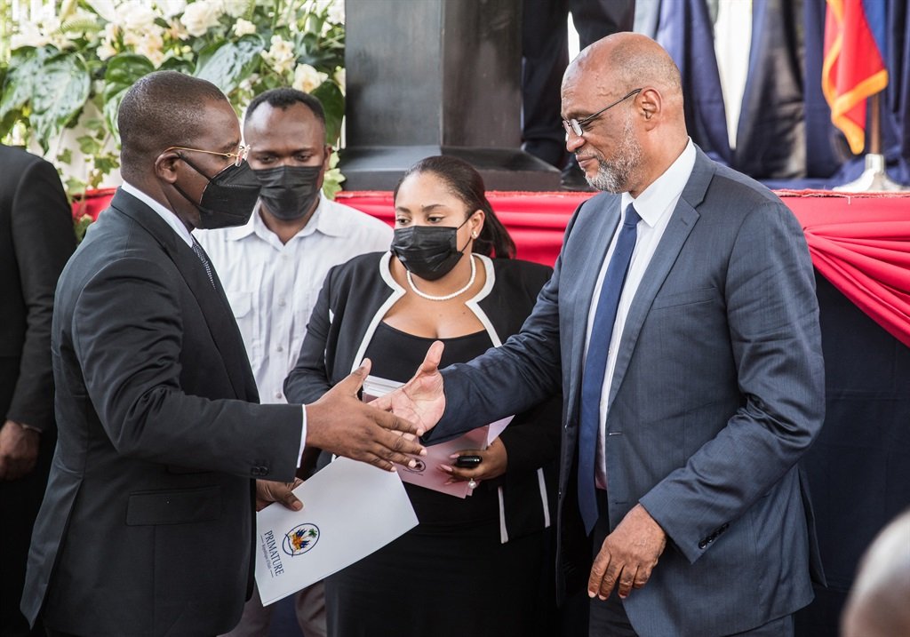 Roiled by presidential assassination, Haiti swears in new PM