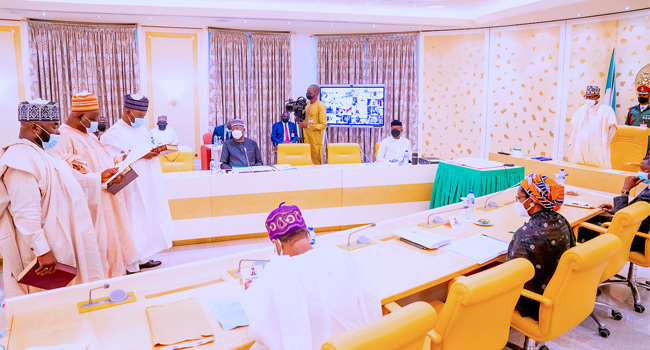 President Buhari swears in three INEC National Commissioners 