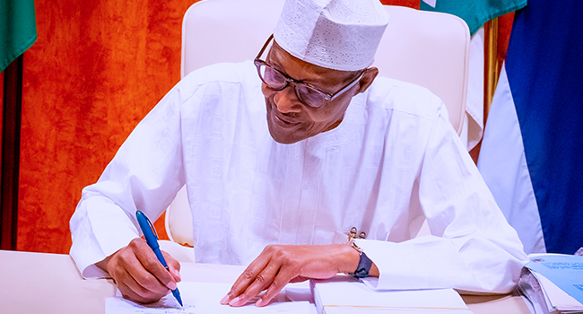 President Buhari signs Climate Change, AMCON Bills into law