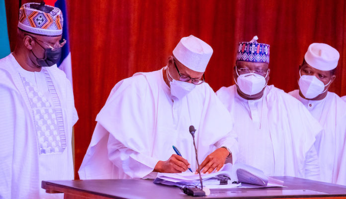Buhari signs money laundering, terrorism bills into law