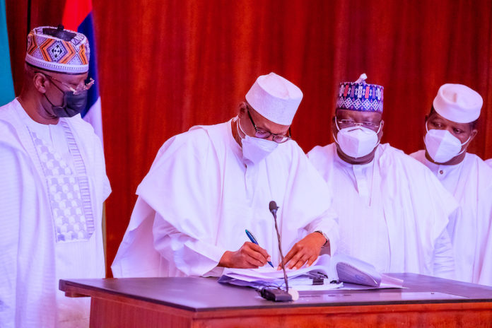Buhari signs money laundering, terrorism bills into law