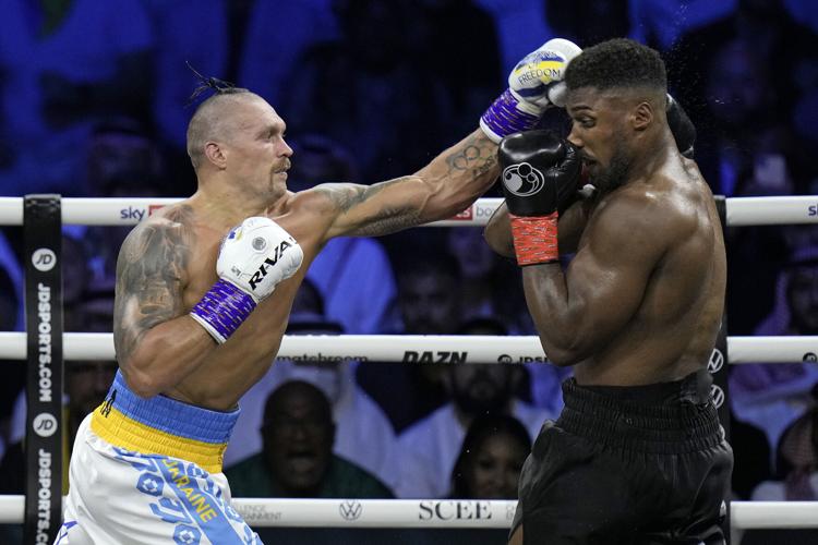 Usyk beats Joshua by split decision in heavyweight title fight