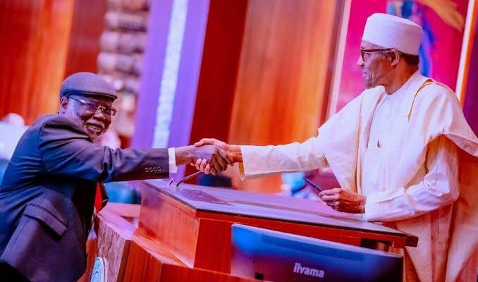 Buhari swears in Justice Ariwoola as CJN