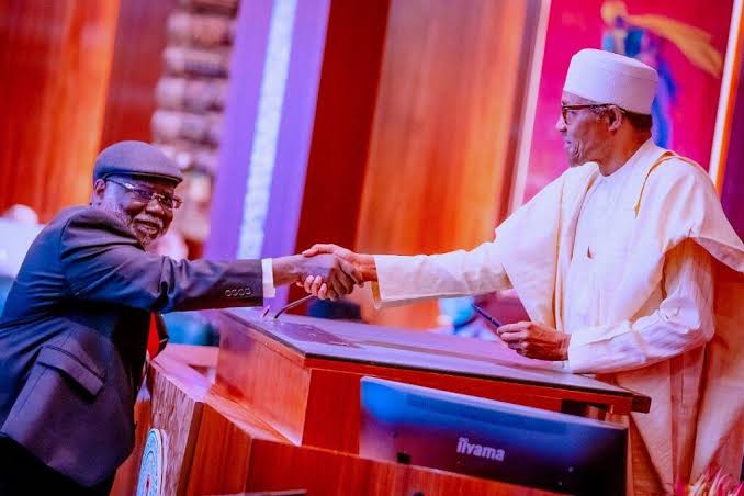 Buhari swears in Justice Ariwoola as CJN